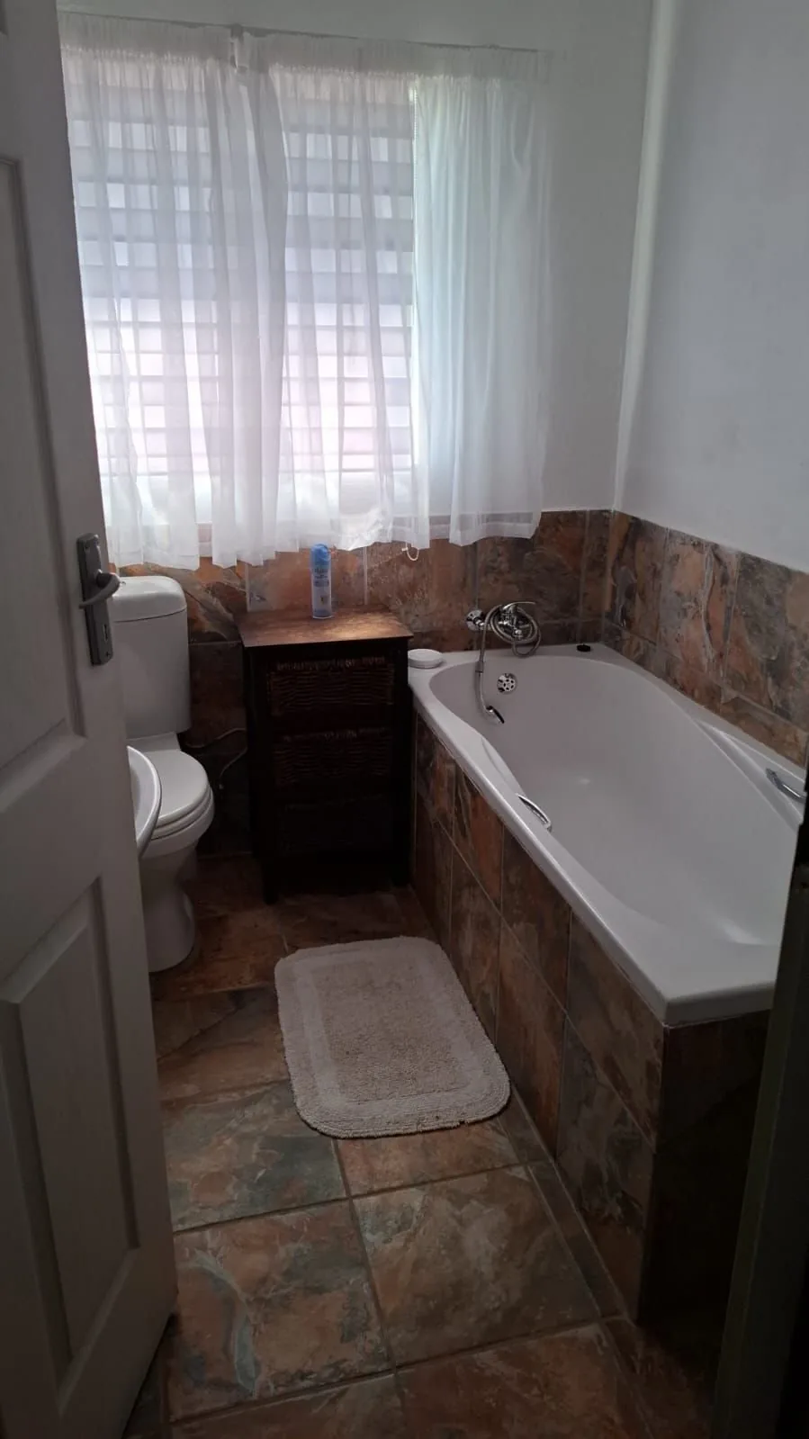 Guest bathroom with bathtub