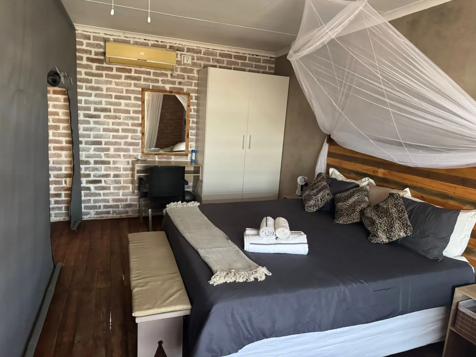 Bedroom with mosquito net and garden view
