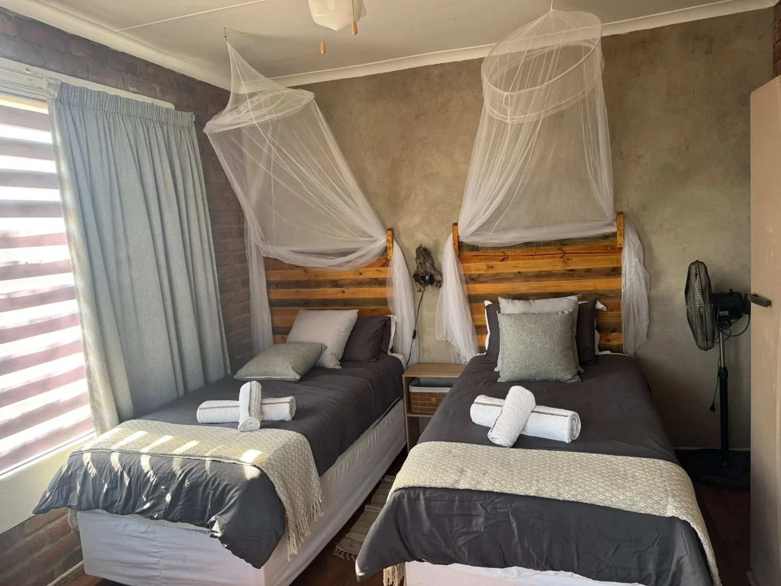 Twin bedroom with mosquito nets