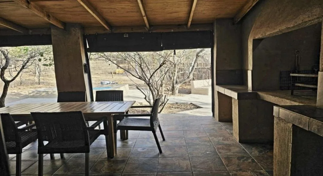 Covered built-in braai and dining table