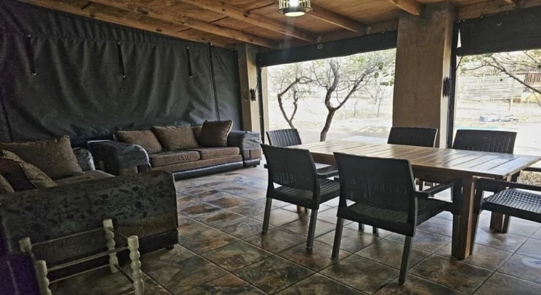 Covered outdoor lounge and dining area