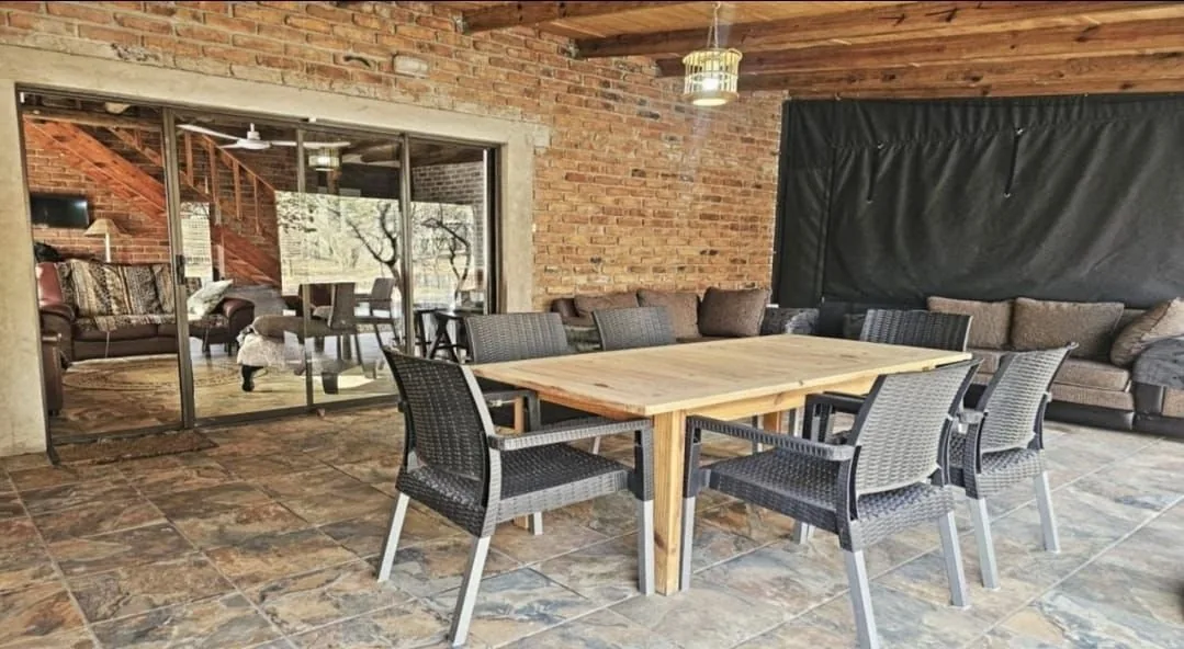 Indoor-outdoor dining area opening onto the boma