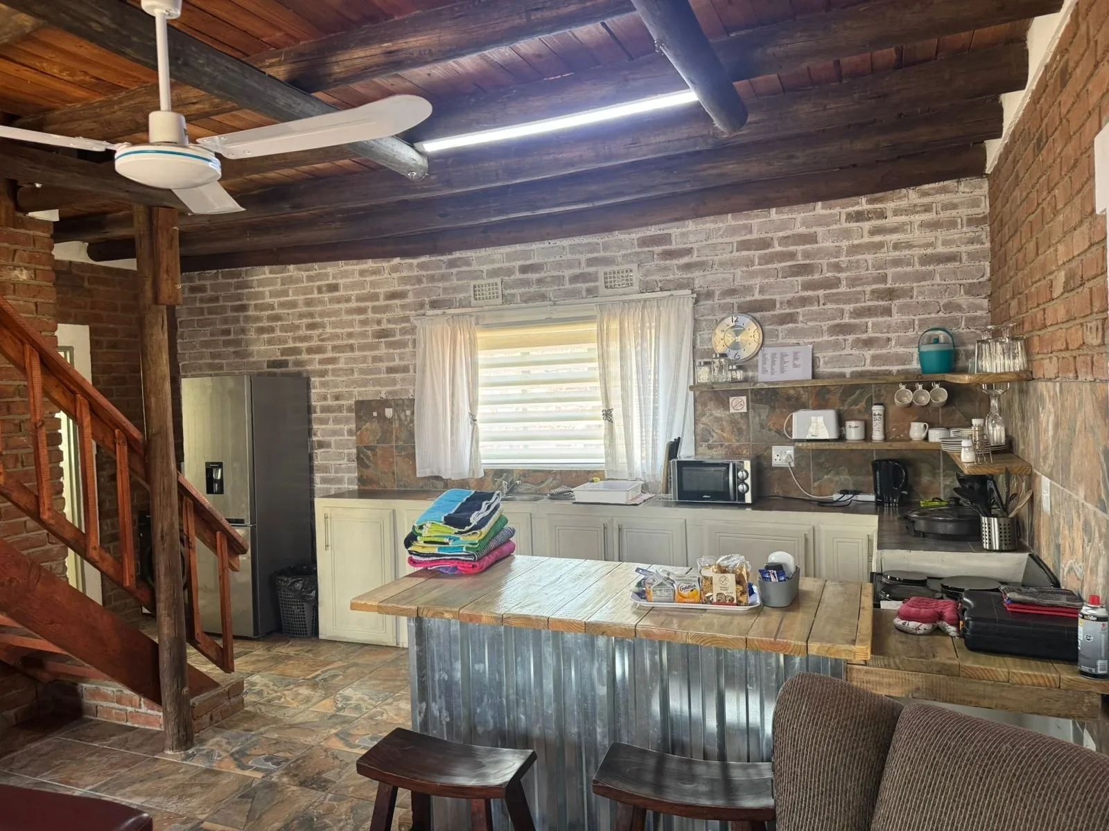 Open-plan kitchen with breakfast counter